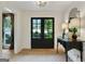 Inviting foyer with black French doors leading to the front yard and custom decor at 591 Clubwood Ct, Marietta, GA 30068