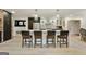 Modern kitchen with a large island, bar seating, and stainless steel appliances at 591 Clubwood Ct, Marietta, GA 30068