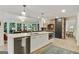 Modern kitchen featuring stainless steel appliances, large island, and open layout to the living spaces at 591 Clubwood Ct, Marietta, GA 30068