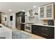 Modern kitchen featuring stainless steel appliances, subway tile backsplash and dark custom cabinetry at 591 Clubwood Ct, Marietta, GA 30068
