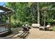 Inviting outdoor gravel patio features comfortable seating and lush landscaping creating a serene backyard retreat at 591 Clubwood Ct, Marietta, GA 30068