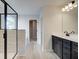 Primary bathroom featuring a glass shower, double vanity with dark cabinets, and modern fixtures at 4434 Eastbrook Pl # 59A, Snellville, GA 30039