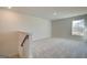 Upstairs bonus room with neutral carpeting, lots of light, and view of the outdoors at 4434 Eastbrook Pl # 59A, Snellville, GA 30039
