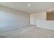 Upstairs bonus room features neutral carpeting, fresh paint, and multiple electrical outlets at 4434 Eastbrook Pl # 59A, Snellville, GA 30039
