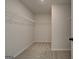 Walk-in closet with wire shelving and neutral carpeting at 4434 Eastbrook Pl # 59A, Snellville, GA 30039