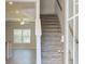 Bright entryway featuring staircase, wood floors, and natural light through a large window at 4434 Eastbrook Pl # 59A, Snellville, GA 30039
