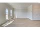 Spacious living room with wood flooring and recessed lighting at 4434 Eastbrook Pl # 59A, Snellville, GA 30039