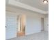 Spacious main bedroom featuring a trey ceiling and doorways to the ensuite bathroom and closet at 4434 Eastbrook Pl # 59A, Snellville, GA 30039
