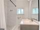 A bathroom featuring a toilet, sink, and tiled shower, with modern fixtures at 1821 Clearwater, Marietta, GA 30067