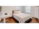 Bright bedroom with hardwood floors, a modern desk, and a comfortable bed at 1821 Clearwater, Marietta, GA 30067