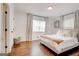 Charming bedroom features a cozy bed, hardwood floors, and modern decor at 1821 Clearwater, Marietta, GA 30067