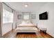 Bright bedroom with hardwood floors, natural light, and modern decor at 1821 Clearwater, Marietta, GA 30067
