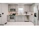Updated kitchen with stainless steel appliances and white subway tile at 1821 Clearwater, Marietta, GA 30067