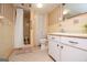 Retro bathroom featuring walk-in shower, tile flooring, and vanity with drawers at 508 College St, Bowdon, GA 30108