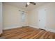 Charming bedroom features hardwood floors, ceiling fan and natural light at 508 College St, Bowdon, GA 30108