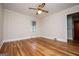 Bedroom with hardwood floors, bright natural light, and neutral wall coloring at 508 College St, Bowdon, GA 30108