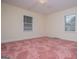 Bedroom featuring pink carpeting, offering comfort and neutral wall paint at 508 College St, Bowdon, GA 30108