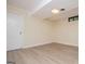 Bright bedroom with light-colored walls, light wood floors and white trim at 508 College St, Bowdon, GA 30108
