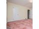 Bedroom features pink carpeting and neutral walls, offering a warm atmosphere at 508 College St, Bowdon, GA 30108