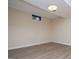 Bright bedroom with light-colored walls, light wood floors and white trim at 508 College St, Bowdon, GA 30108