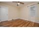 Charming bedroom features hardwood floors, ceiling fan and natural light at 508 College St, Bowdon, GA 30108