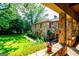 Exterior view of the stone-clad home from the carport at 508 College St, Bowdon, GA 30108