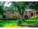 Exterior of a two-story stone home with lush green lawn and mature trees at 508 College St, Bowdon, GA 30108