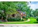 Charming stone home with red awnings and a lush, green lawn at 508 College St, Bowdon, GA 30108