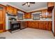 A kitchen area featuring stainless-steel appliances, wood cabinets, and lots of natural light at 508 College St, Bowdon, GA 30108