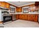 A kitchen area featuring stainless-steel appliances, wood cabinets, countertops and lots of natural light at 508 College St, Bowdon, GA 30108