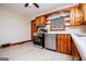 A kitchen area featuring stainless-steel appliances, wood cabinets, countertops and lots of natural light at 508 College St, Bowdon, GA 30108