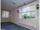 Charming living room with bright windows, allowing natural light to flood the space, enhancing its appeal at 508 College St, Bowdon, GA 30108