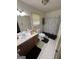 Functional bathroom with a vanity, toilet, and shower featuring a black and white shower curtain at 3929 Rockey Valley Dr, Conley, GA 30288