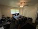 Spacious bedroom with a ceiling fan, a comfortable bed, and ample natural light at 3929 Rockey Valley Dr, Conley, GA 30288