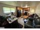 Cozy kitchen with wooden cabinets, black appliances, and functional layout open to dining and living at 3929 Rockey Valley Dr, Conley, GA 30288