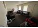 Spacious living room featuring neutral walls, carpet, and two large windows for natural light at 3929 Rockey Valley Dr, Conley, GA 30288