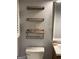 Bright bathroom with storage shelves and a modern toilet at 276 Colewood Nw Way, Atlanta, GA 30328