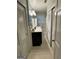 Bathroom with white cabinetry, tiled floors and plantation shutters at 276 Colewood Nw Way, Atlanta, GA 30328