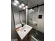 Well-lit bathroom featuring vanity with sink and modern glass shower at 276 Colewood Nw Way, Atlanta, GA 30328
