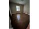 Bedroom featuring hardwood floors, window for natural light and closet at 276 Colewood Nw Way, Atlanta, GA 30328