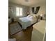 Bedroom with hardwood floors and lots of natural light at 276 Colewood Nw Way, Atlanta, GA 30328