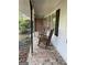 Comfortable front porch with brick floor featuring two classic rocking chairs at 276 Colewood Nw Way, Atlanta, GA 30328