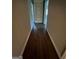 A hardwood floor runs through the hallway leading to other areas of the home at 276 Colewood Nw Way, Atlanta, GA 30328