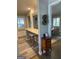 Hallway with a breakfast bar, hardwood floors and access to the dining room at 276 Colewood Nw Way, Atlanta, GA 30328
