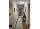 Hallway featuring a built-in bookcase and neutral color scheme at 276 Colewood Nw Way, Atlanta, GA 30328