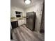 Kitchen with stainless steel refrigerator and white cabinetry at 276 Colewood Nw Way, Atlanta, GA 30328
