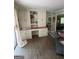 Spacious living room features custom built-ins and hardwood floors at 276 Colewood Nw Way, Atlanta, GA 30328