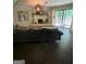 The living room is adjacent to an outside deck and features a fireplace and hardwood floors at 276 Colewood Nw Way, Atlanta, GA 30328