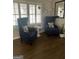 Cozy seating area with two wingback chairs at 276 Colewood Nw Way, Atlanta, GA 30328
