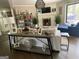 Living room with a decorative fireplace and large window, providing natural light at 276 Colewood Nw Way, Atlanta, GA 30328